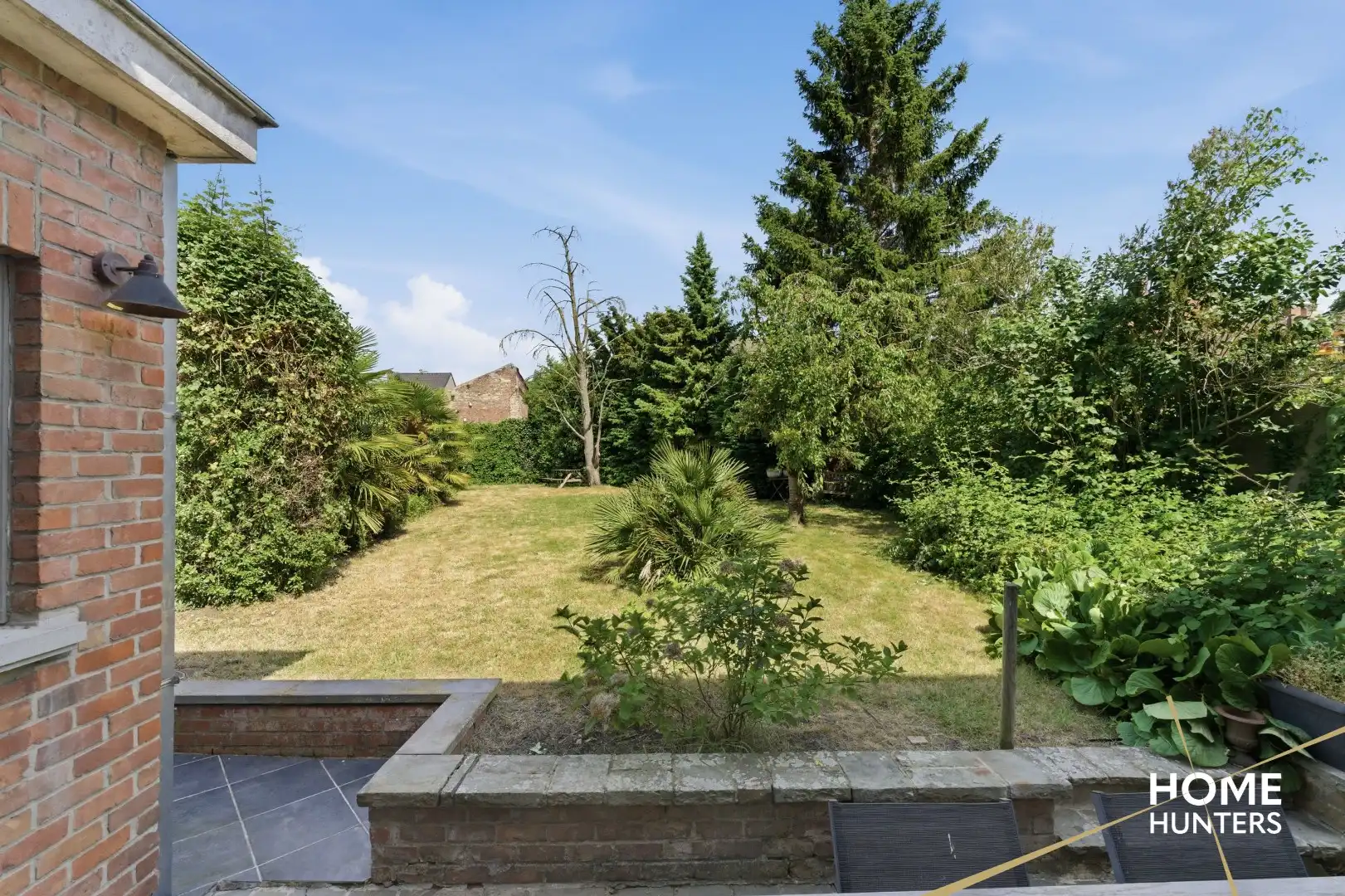 Statige stadswoning met uitzonderlijke volumes, garage en prachtige tuin in hartje Ieper foto 35