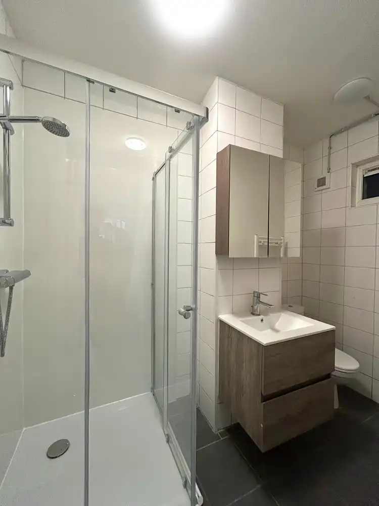 Instapklaar gelijkvloers 1-slaapkamerappartement met ruim terras in Leuven foto 9