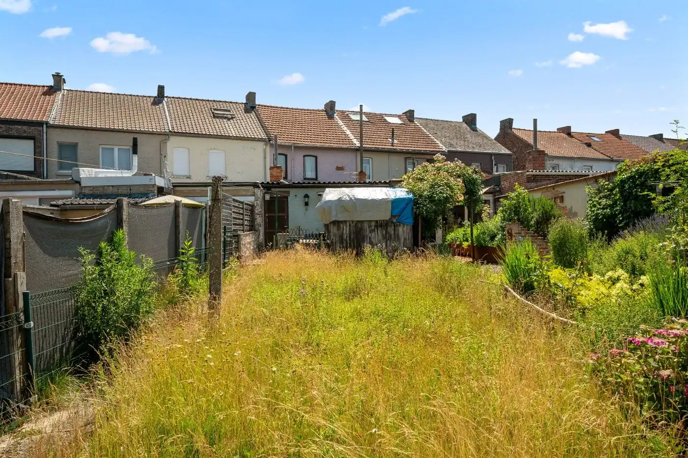 Te renoveren rijwoning in Attenhoven met tuin, garage en 3 slaapkamers foto 3