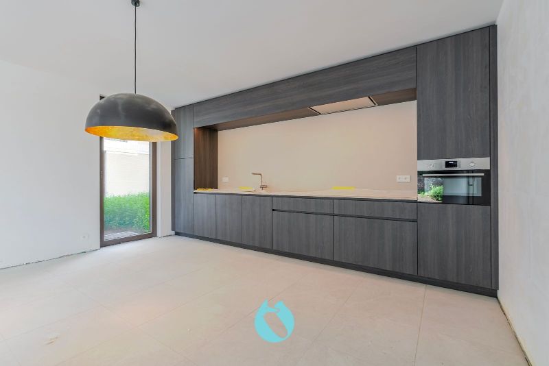Green Square presenteert u 35 nieuwbouwappartementen en een winkelpand, letterlijk ónder de Kerktoren van Sleidinge. foto 3