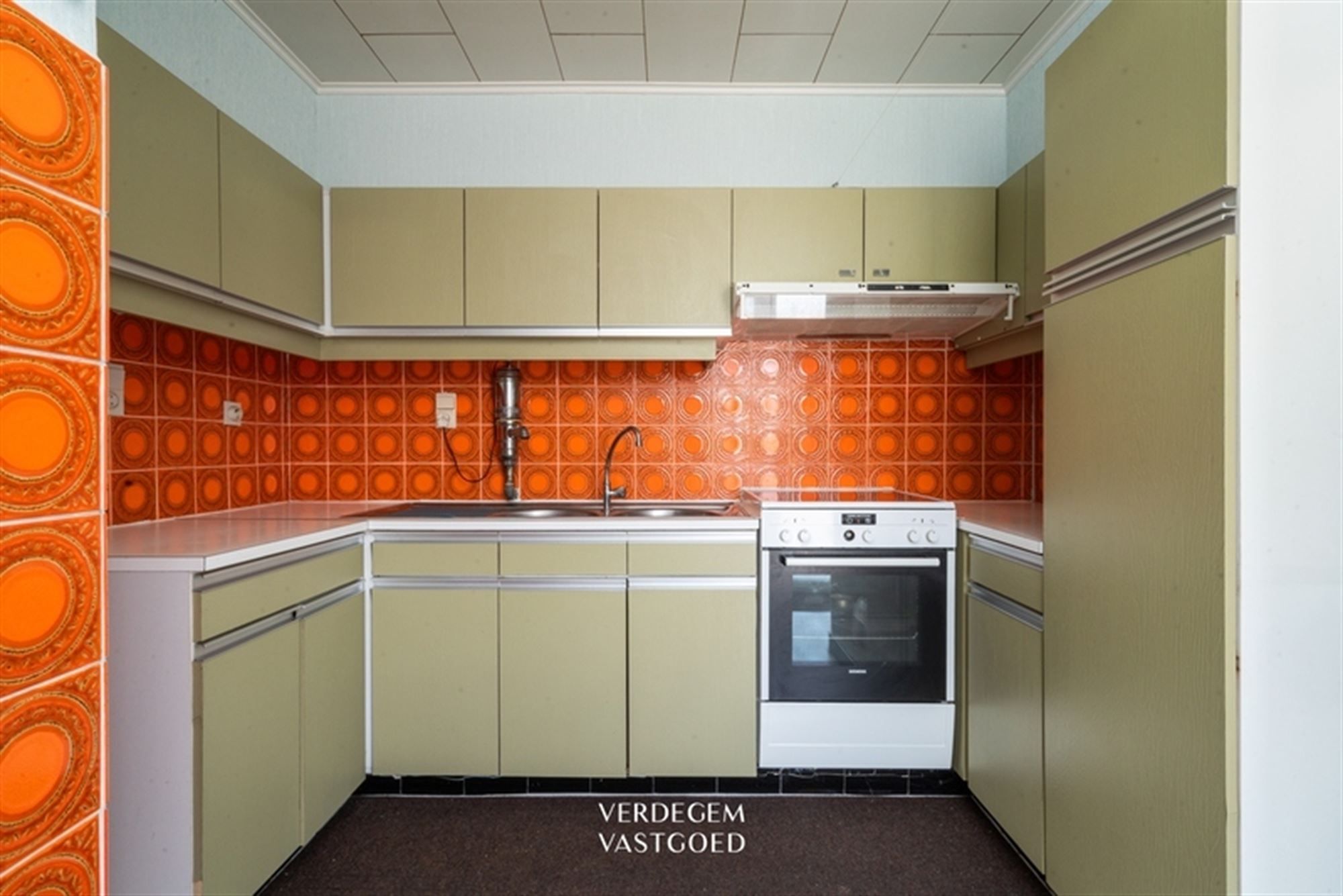 Jaren '60 woning met 4 slaapkamers, garage en leuke tuin foto 8