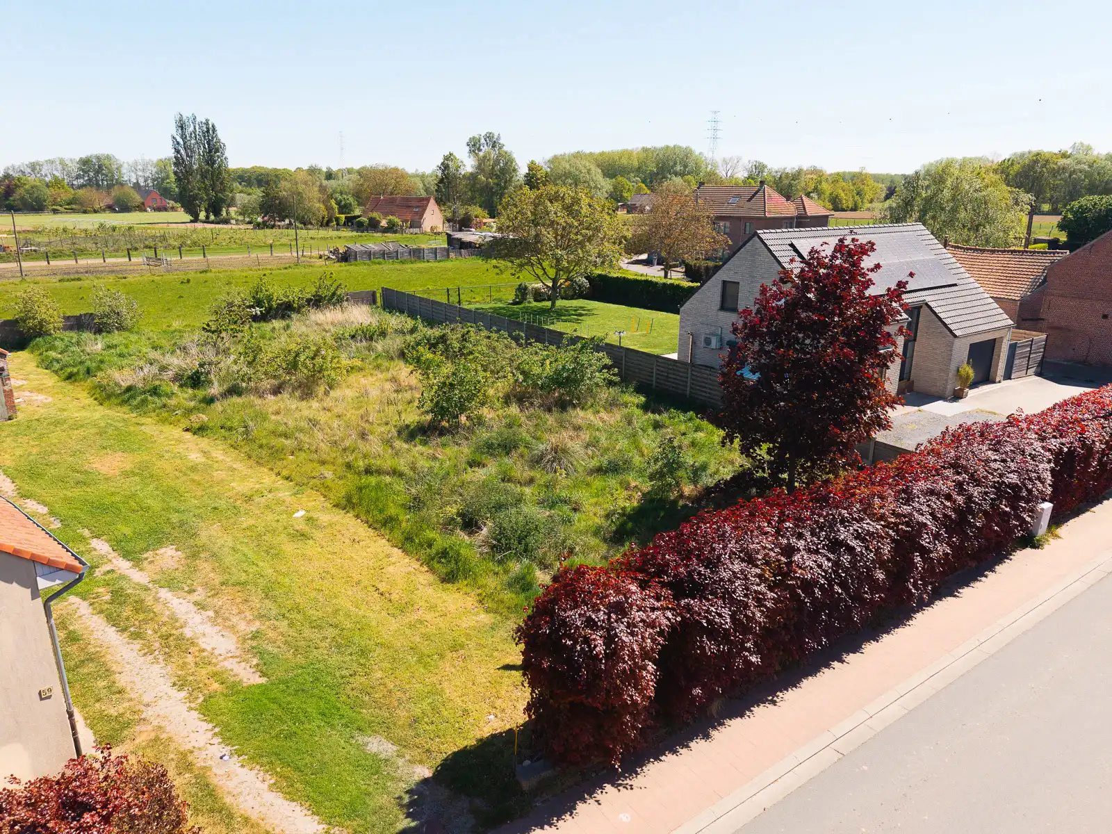 Bouwgrond voor open bebouwing op zeer gunstige ligging foto {{pictureIndex}}