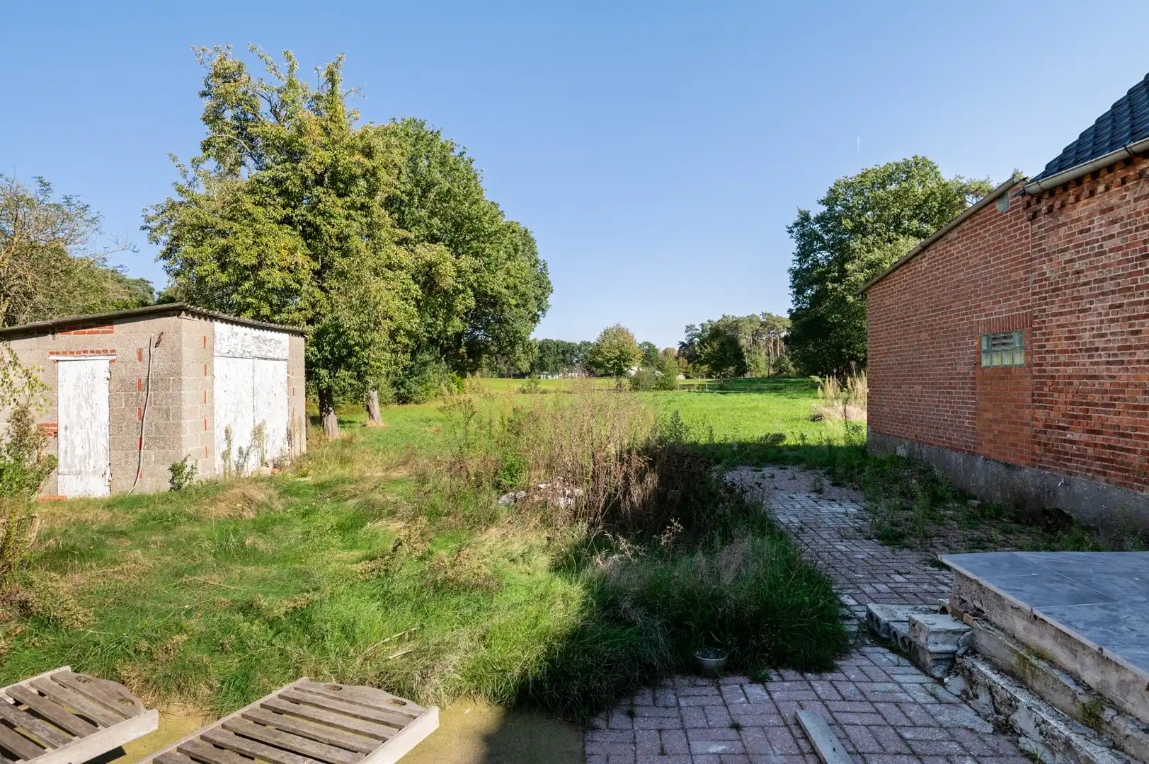 Vrijstaande woning op een ruim perceel van 3.330 m² met prachtig groen uitzicht en tal van mogelijkheden foto 32