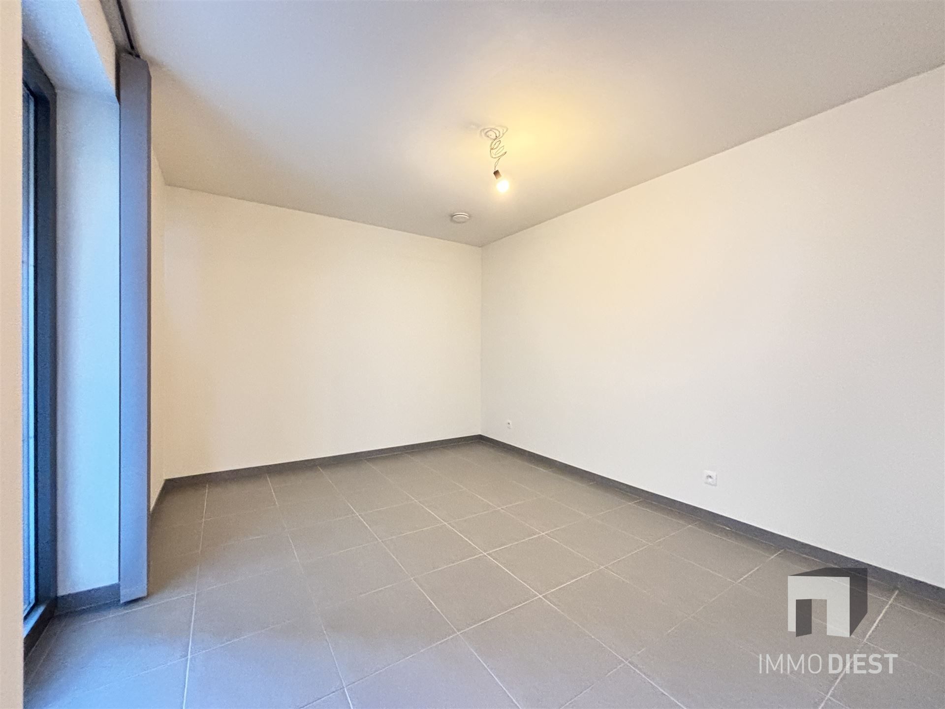 Ruim appartement op de tweede verdieping in het centrum van Tessenderlo foto 9