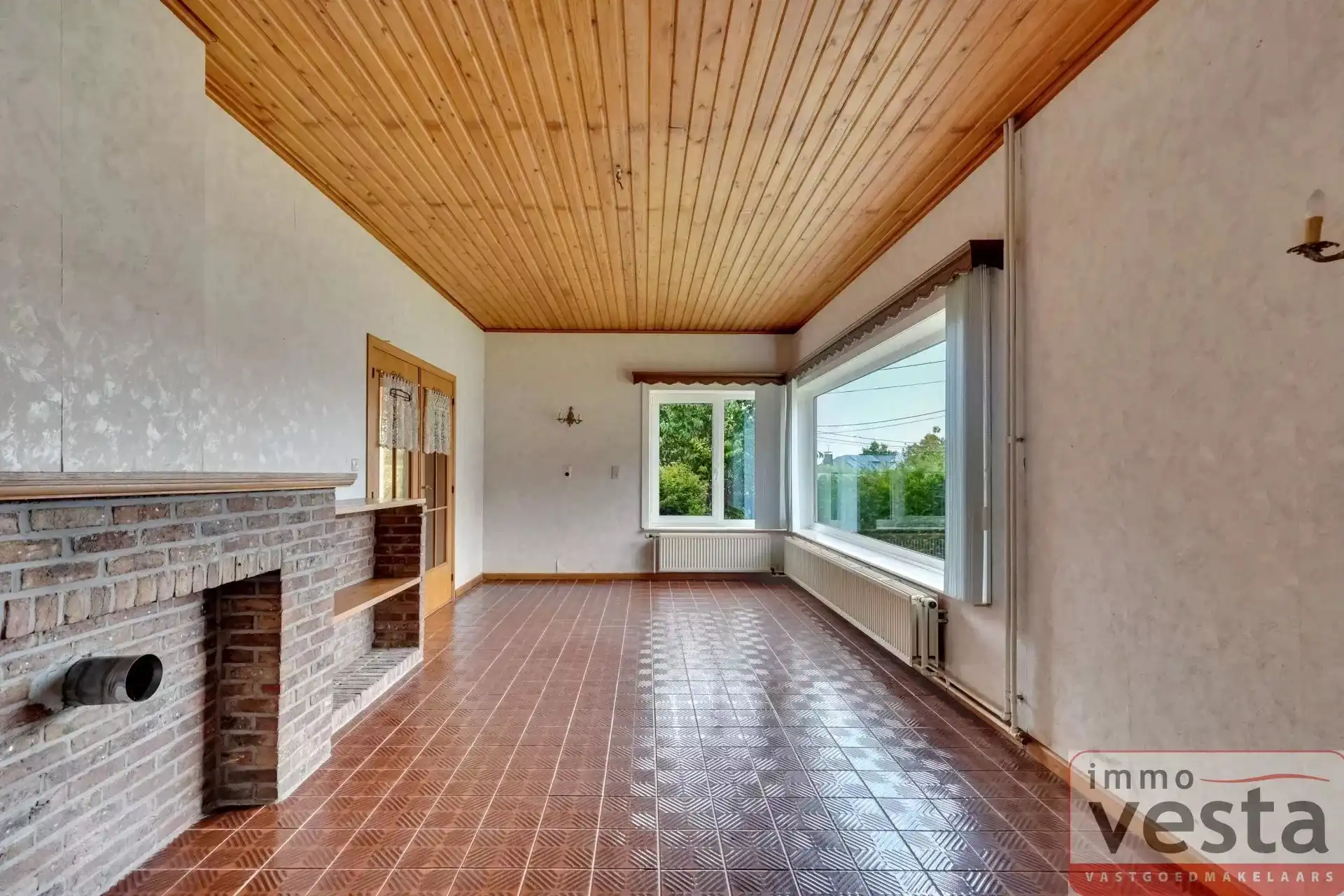 Bungalow met vier slaapkamers, inpandige garage en ruime tuin in Kortessem foto 4