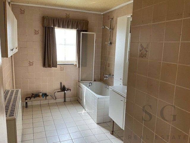 Te renoveren vrijstaande woning op ruim perceel tussen Bocholt en Bree – rust en potentieel op meer dan 32 are foto 7
