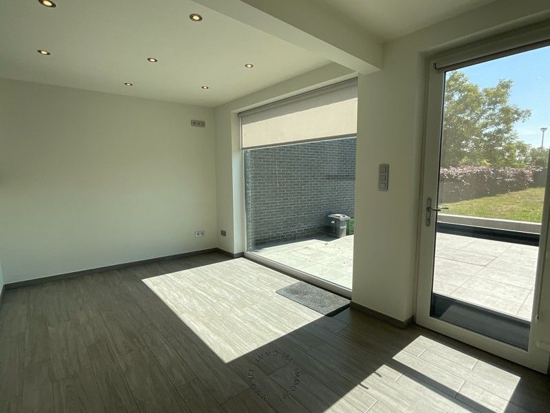 Halfopen bebouwing dichtbij centrum Beveren foto 4