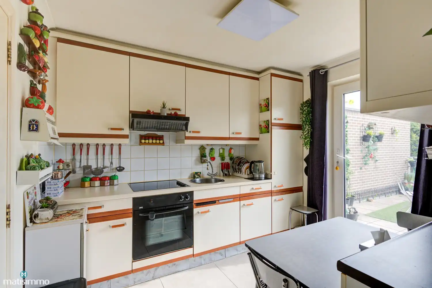 GOED ONDERHOUDEN APPARTEMENT MET GARAGE, KELDER EN RUIM ZUIDWESTGEORIËNTEERD TERRAS IN BILZEN foto 9