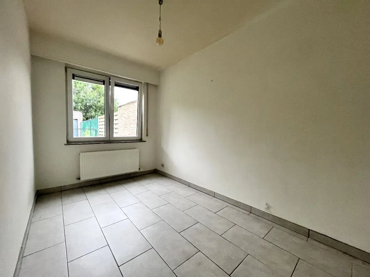 Hedendaags 2-slpk appartement met tuin, garage en kelder foto 9