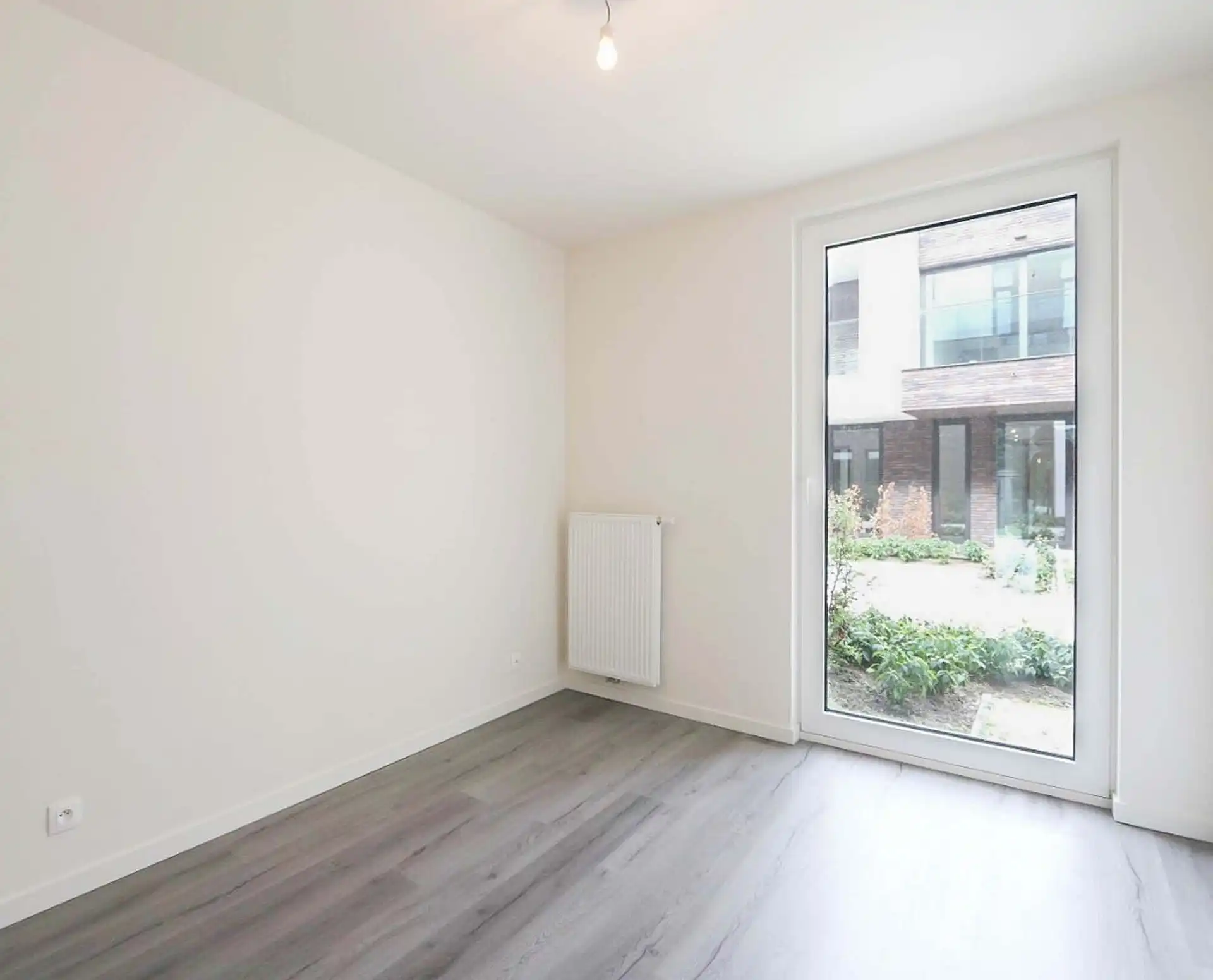 Gelijkvloers appartement met tuin in recent gebouw foto 8