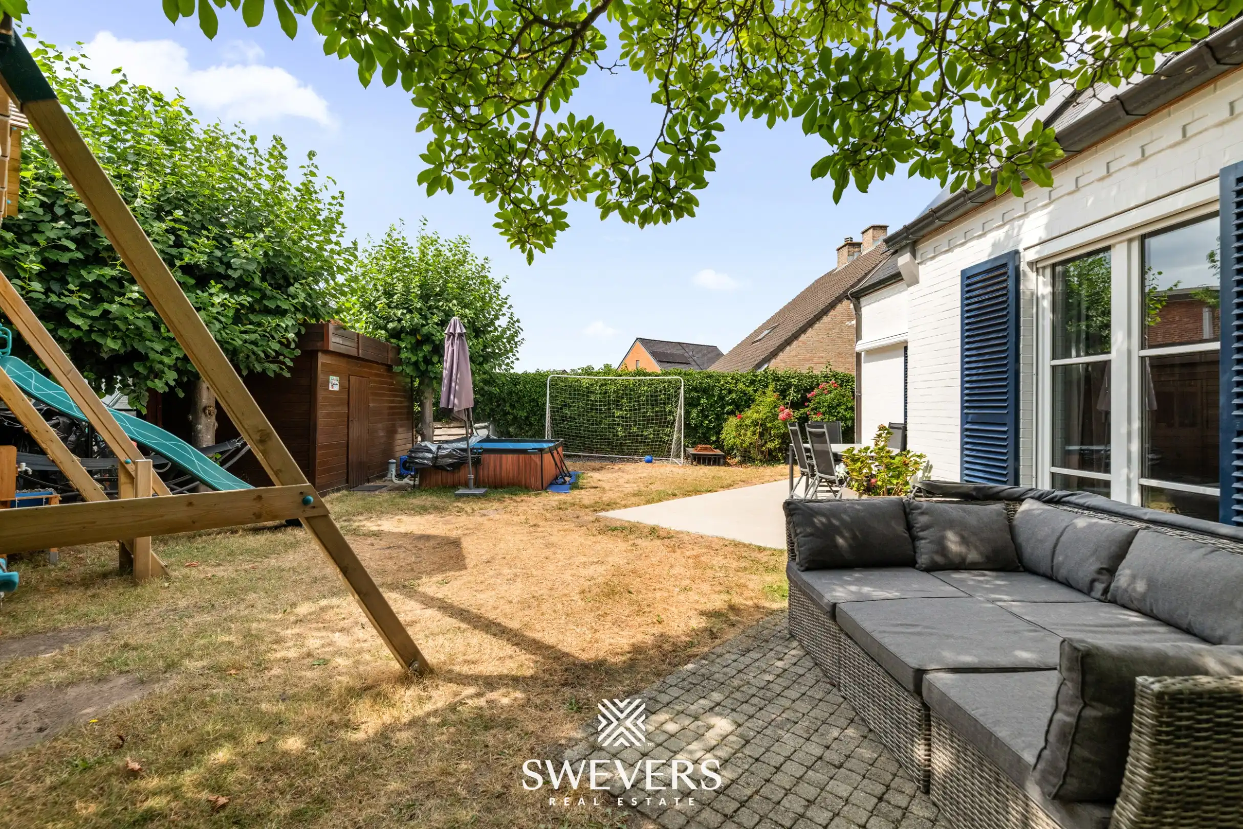 Instapklare ruime gezinswoning met zuidwestelijke tuin in Tuilt foto 28
