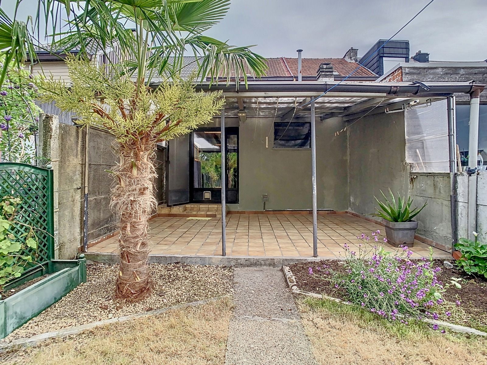 Mooie stadswoning met 2 SLPK,tuin en optionele garage! foto 20