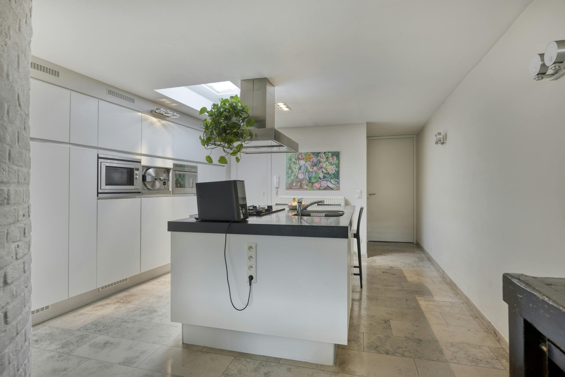 Stijlvolle stadswoning met handelspand te koop in hartje Maaseik foto 5