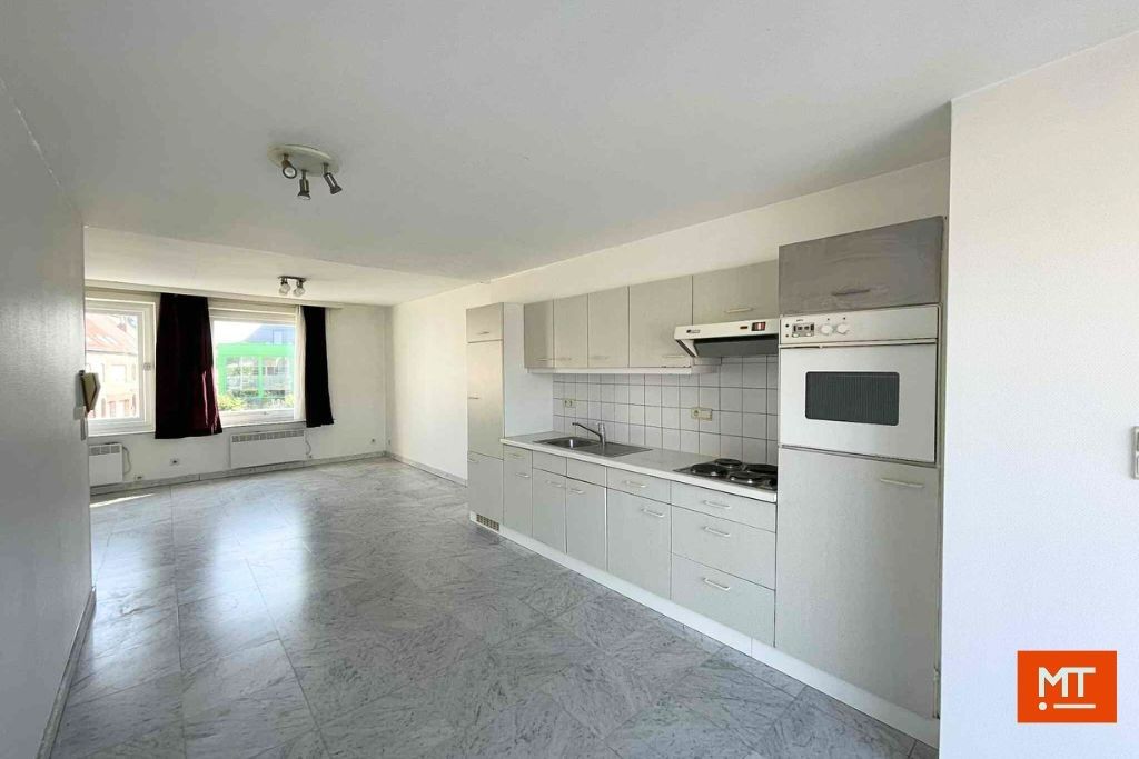 Veelzijdig gebouw bestaande uit handelsruimte, woning en appartement in het centrum van Wervik foto 18