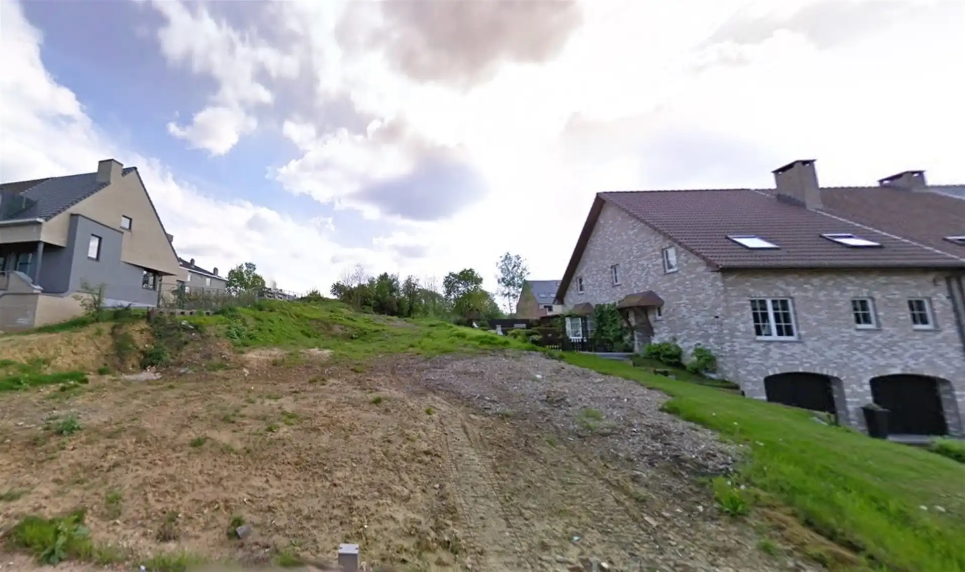 Bouwgrond te koop in Zellik - ideale ligging voor halfopen bebouwing  foto {{pictureIndex}}