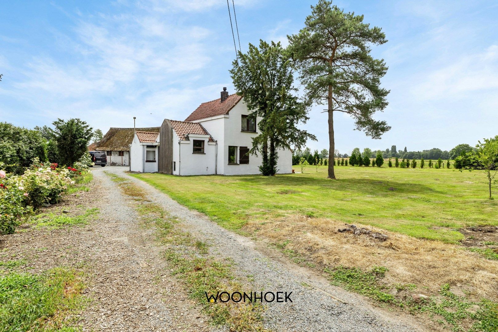 Hoofdfoto van de publicatie: Woning met 2 magazijnen op uniek perceel!