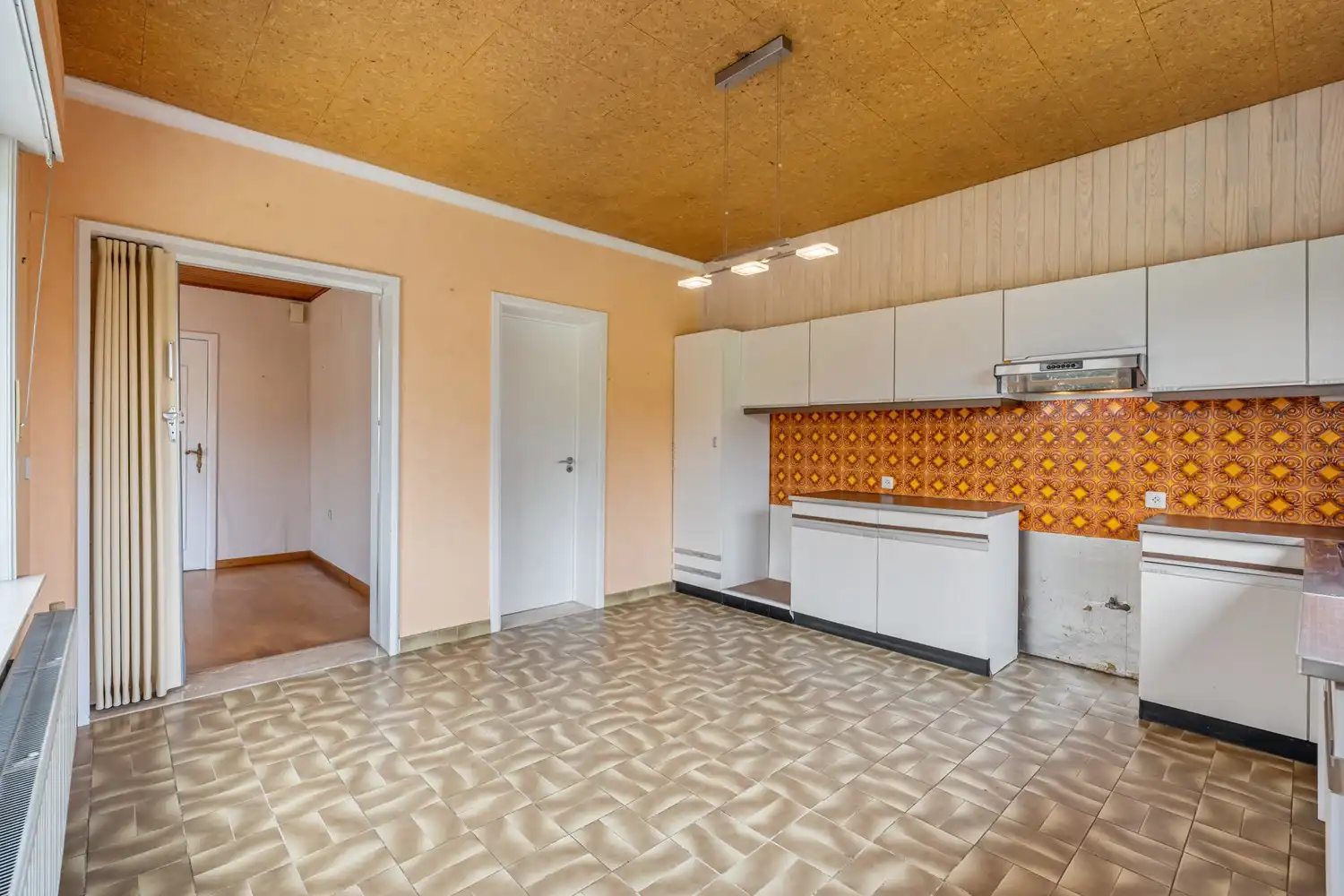 Goed gelegen woning met 4 slaapkamers, een garage en een diepe tuin in een verkeersluwe straat te Kessel-Lo! foto 10