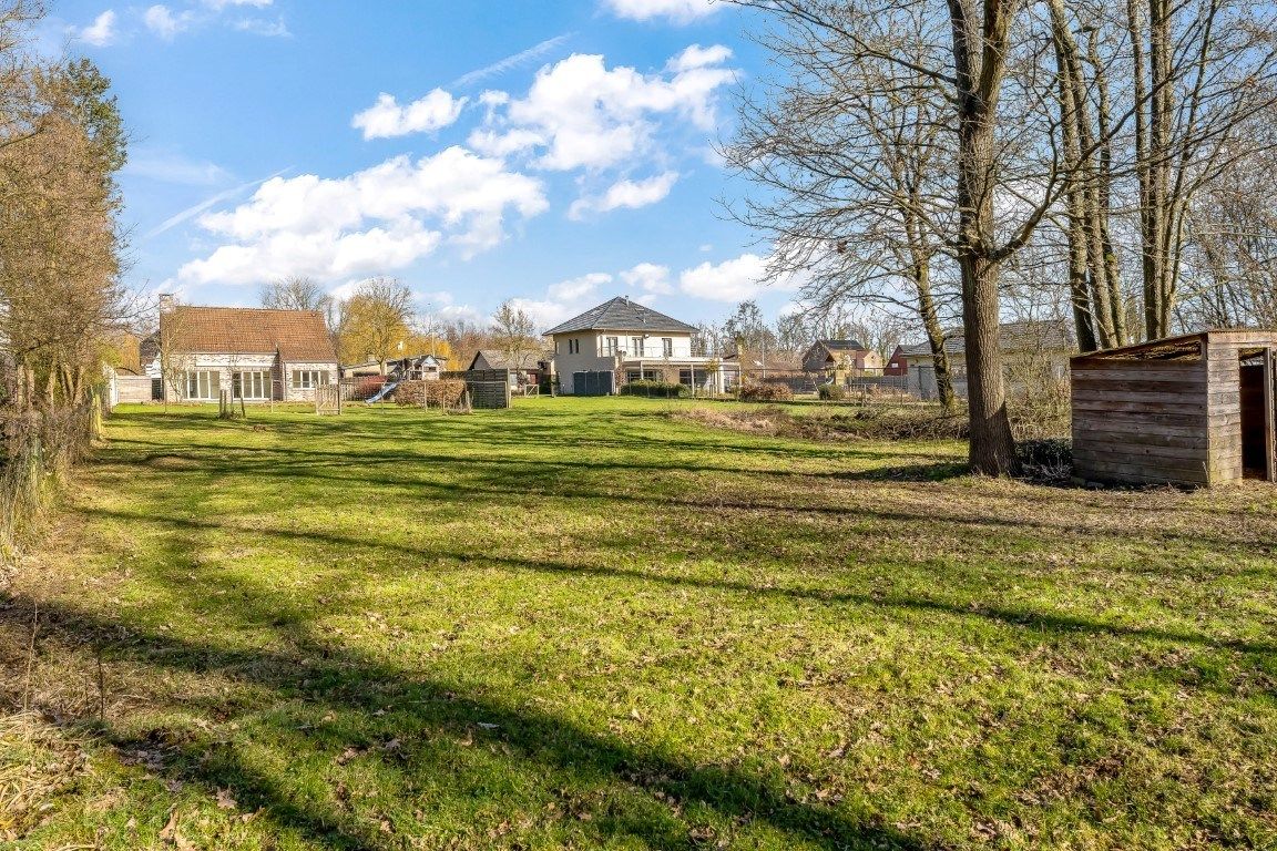 Ruim ingedeelde volledig onderkelderde woning met oa 4 slpks op 23are foto 31