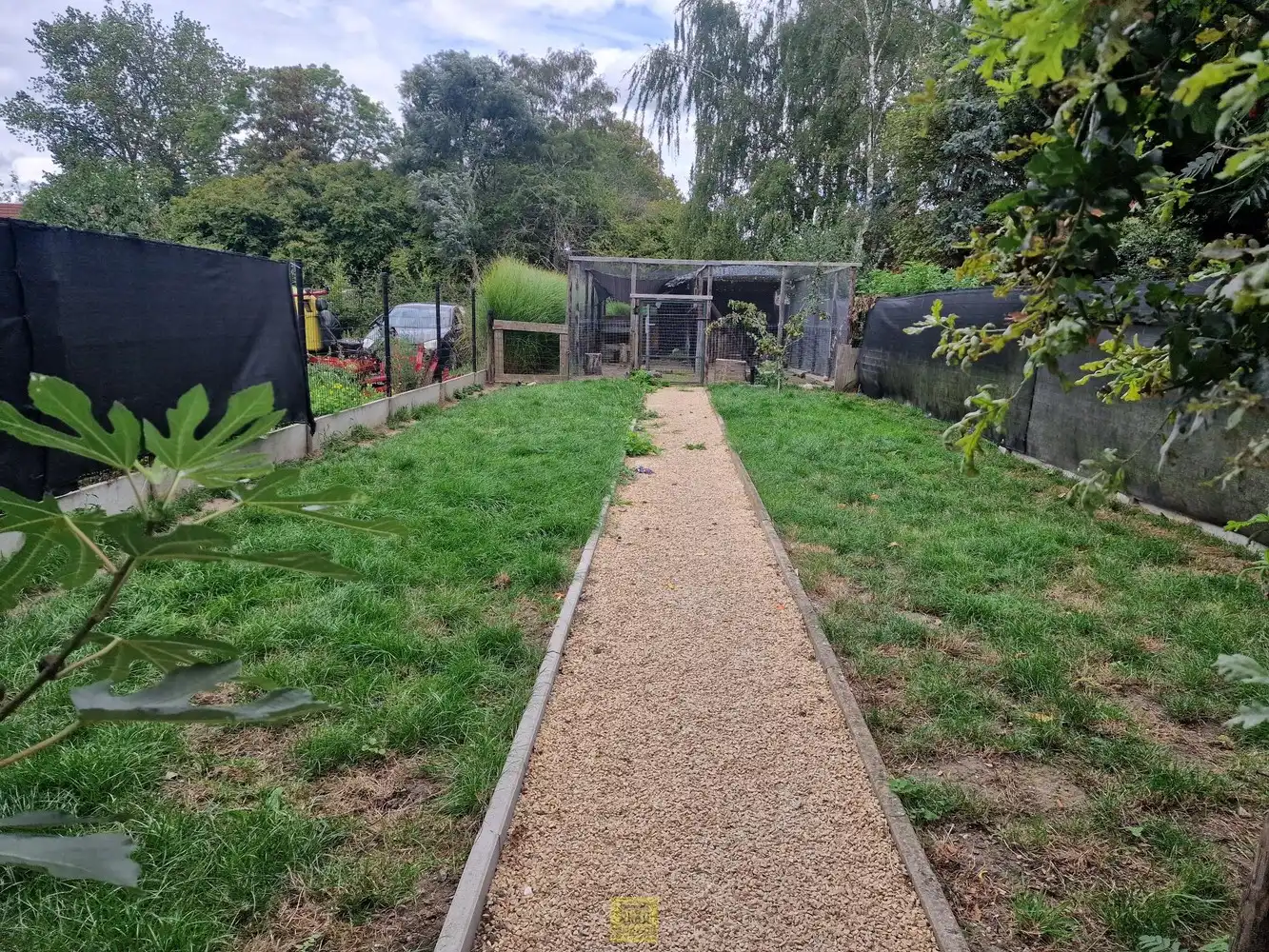 Rustig en centraal gelegen in Haaltert – gebouw met 2 duplexappartementen en 2 ruime garages! foto 17