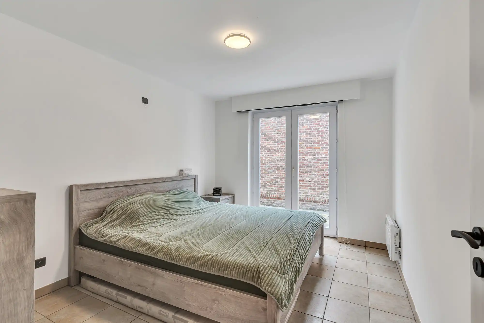 Ruim gelijkvloers appartement met tuin en garage in Deinze foto 9