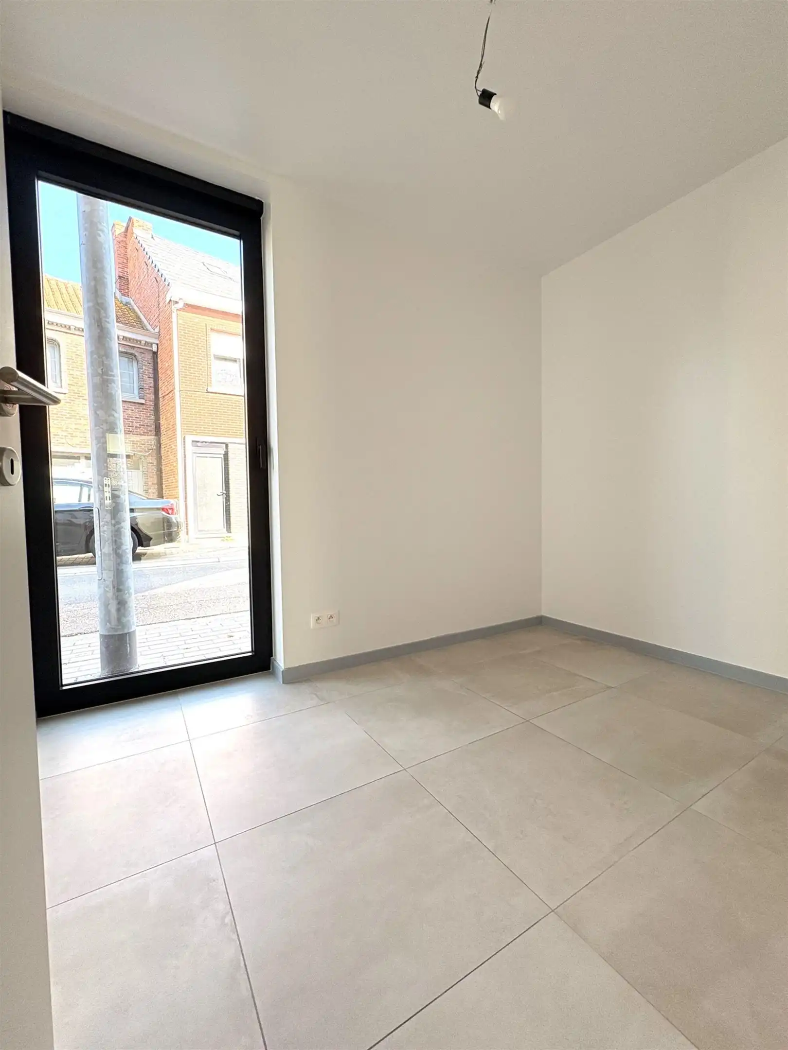 Modern en instapklaar gelijkvloers appartement met terras, tuin en ondergrondse staanplaats in Grembergen foto 12