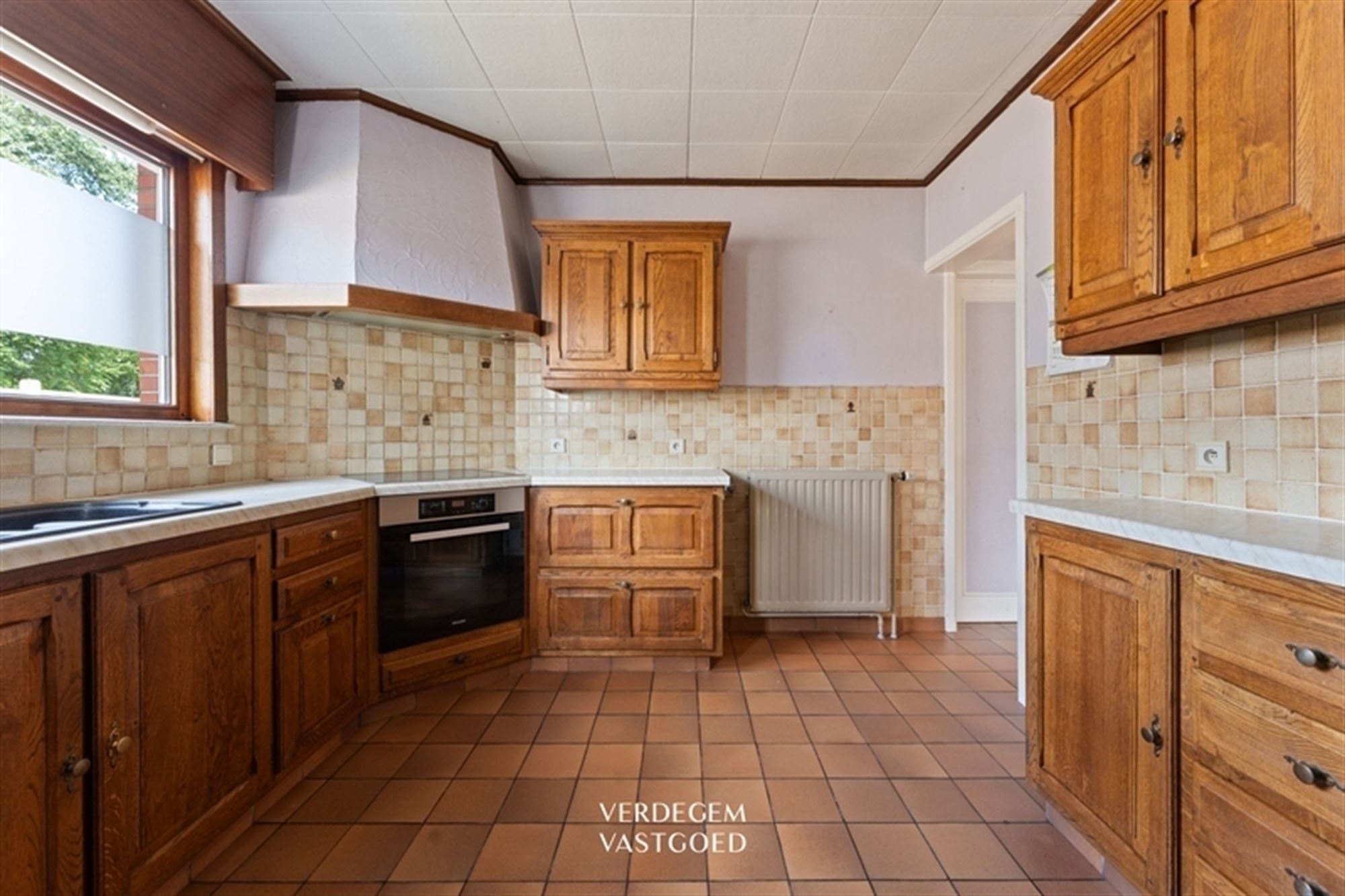 Karaktervolle woning met jaren '50 charme, 3 slaapkamers, garage en gezellige tuin foto 6