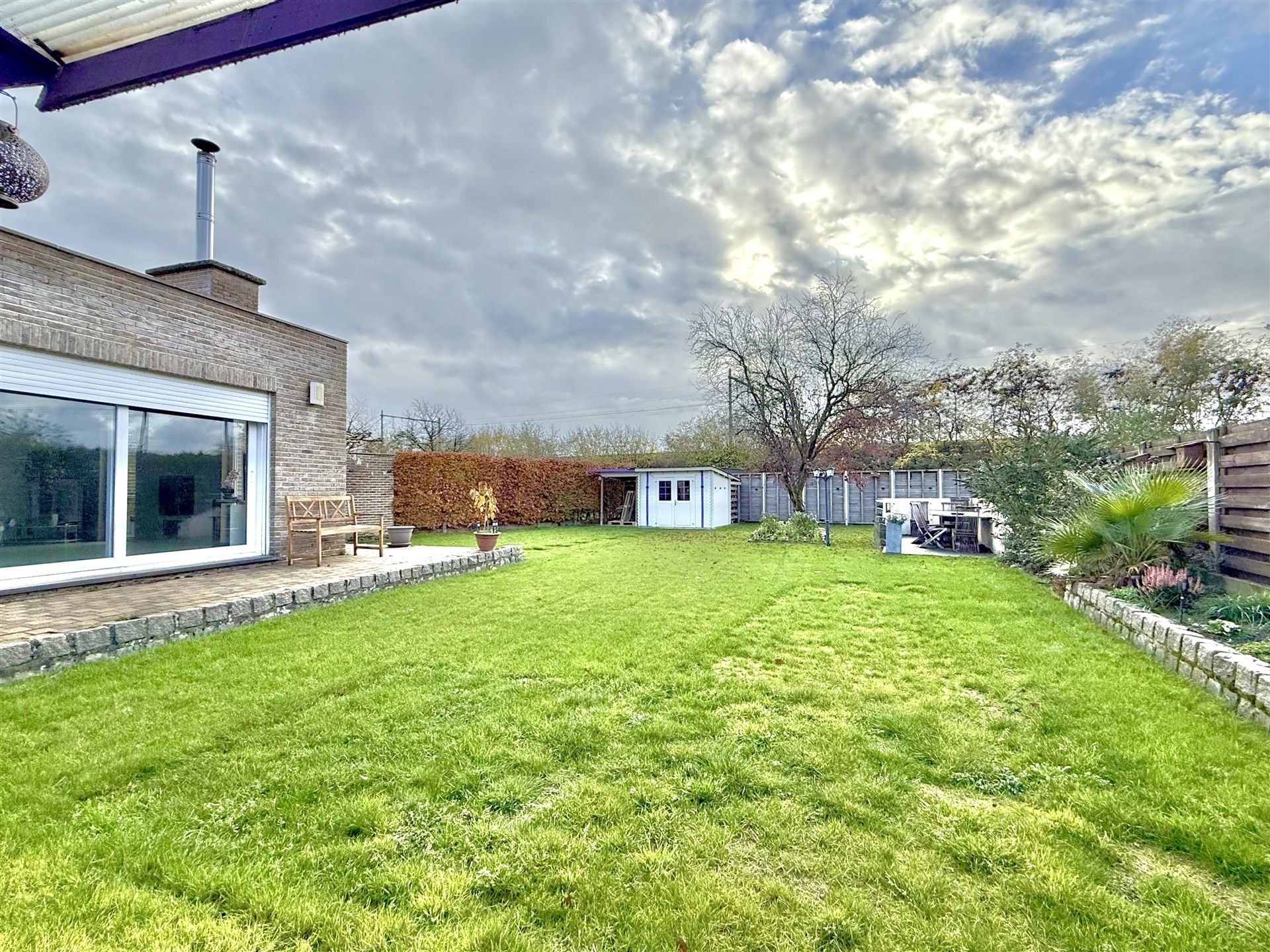 Woning half-open bebouwing met tuin foto 26