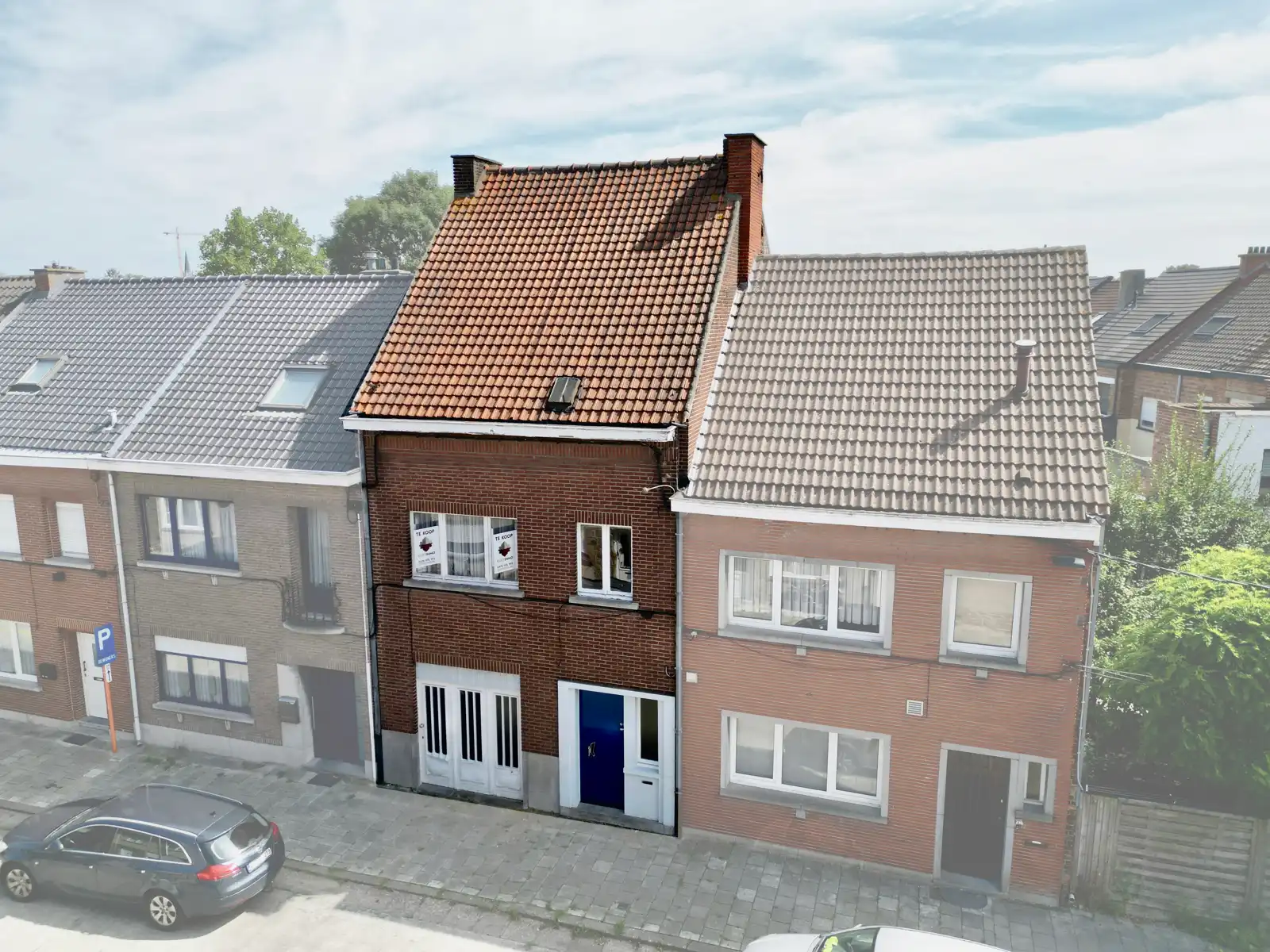 Hoofdfoto van de publicatie: Woning met 4 SLPK, Tuin, Garage én mooi renovatiepotentieel!