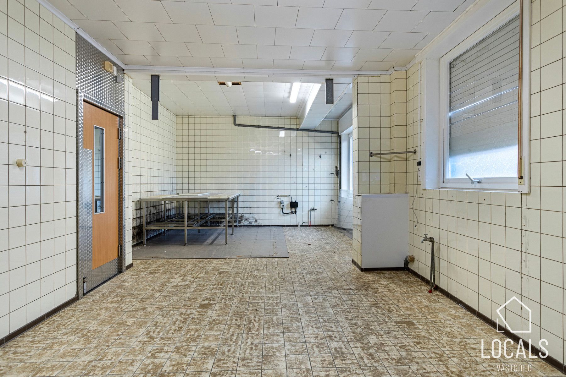 Veelzijdig pand: handelsruimte met woonst & parkeerplaatsen foto 5