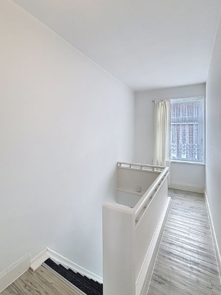 Knusse rijwoning foto 8
