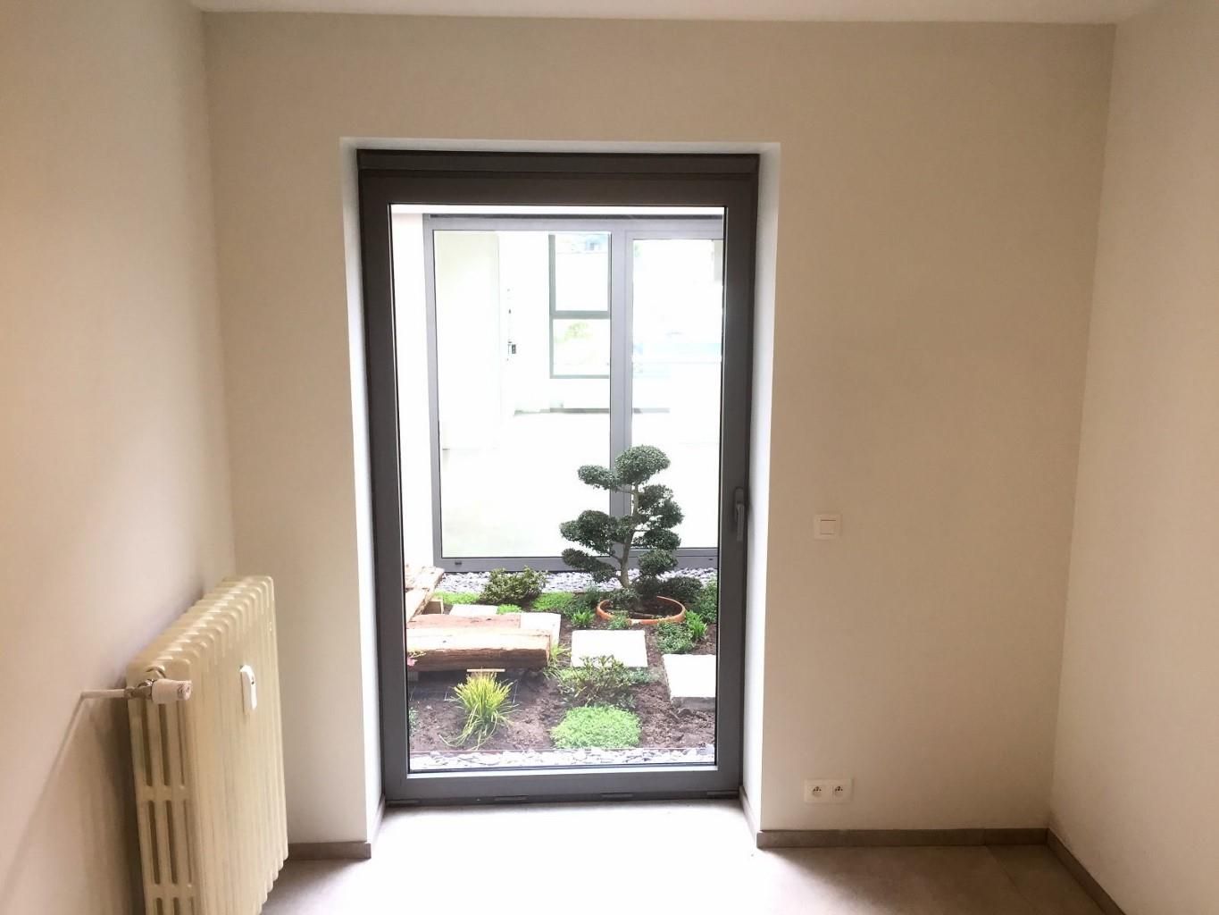 Ruim, verzorgd gelijkvloersappartement met terras en garage foto 12