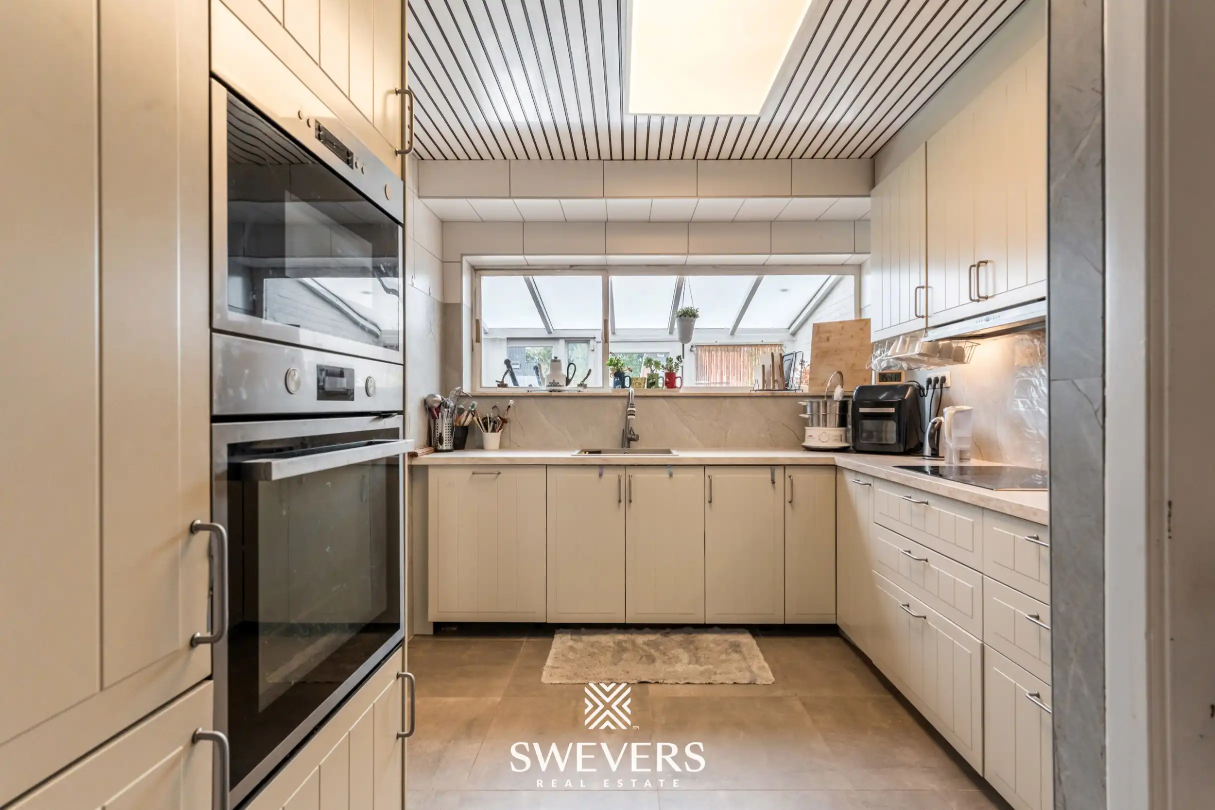 Ruime split-levelwoning op rustige locatie in Diepenbeek (mogelijkheid tot 2 HOB) foto 5