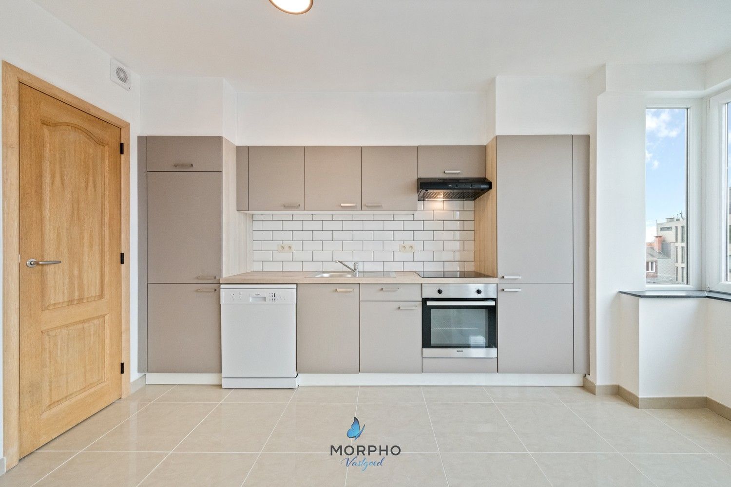 Modern en energiezuinig 2-slaapkamerappartement op de derde verdieping in hartje Temse! foto 3