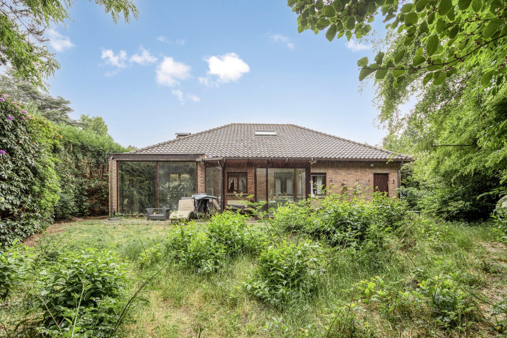 Gelijkvloerse woning met 2 slpks en inpandige garage op 824 m² !  foto 19