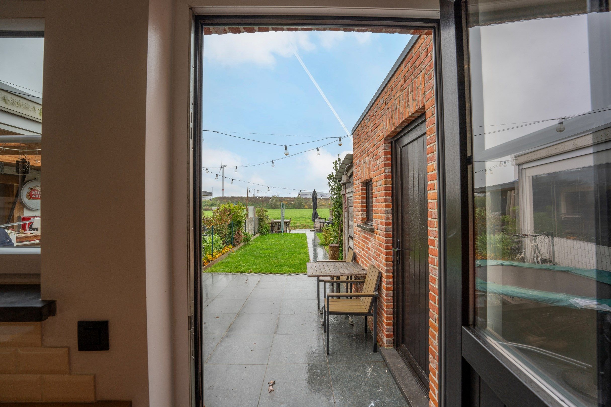 Rijwoning met een fraaie tuin aan het water te Zwankendamme foto 8