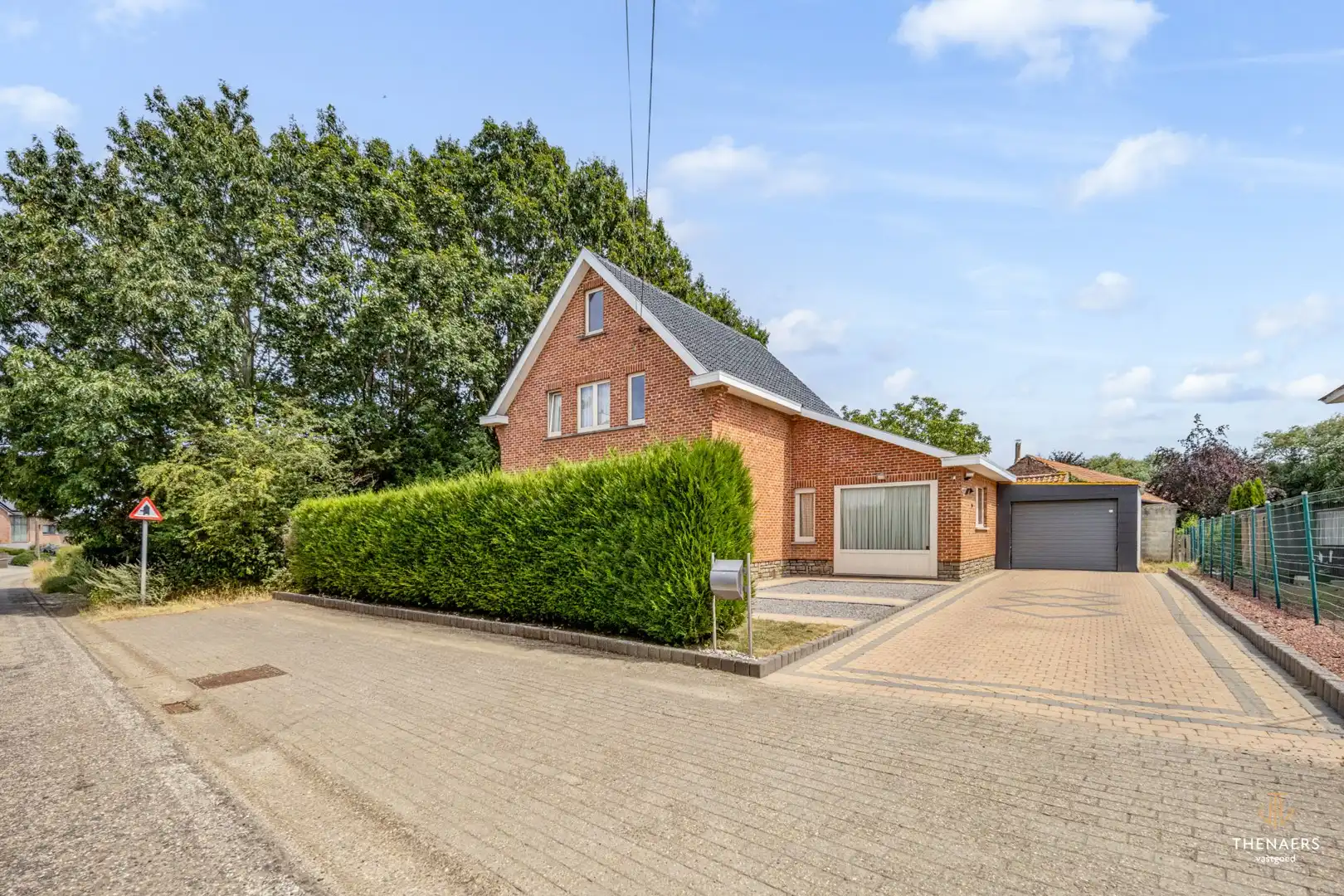 Gezinswoning met drie slaapkamers, garage en aangename buitenruimtes in het landelijke Opheers. foto 30
