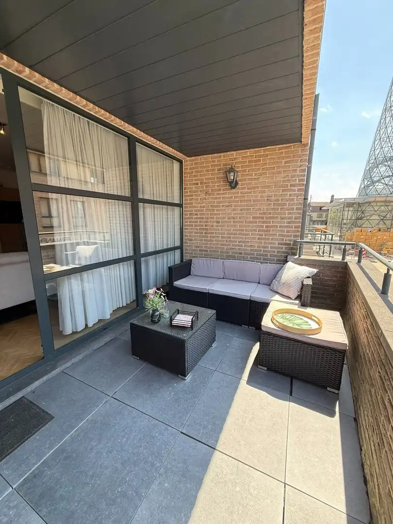 Instapklaar 1-slaapkamerappartement met terras en garagebox in hartje Lommel. foto 13