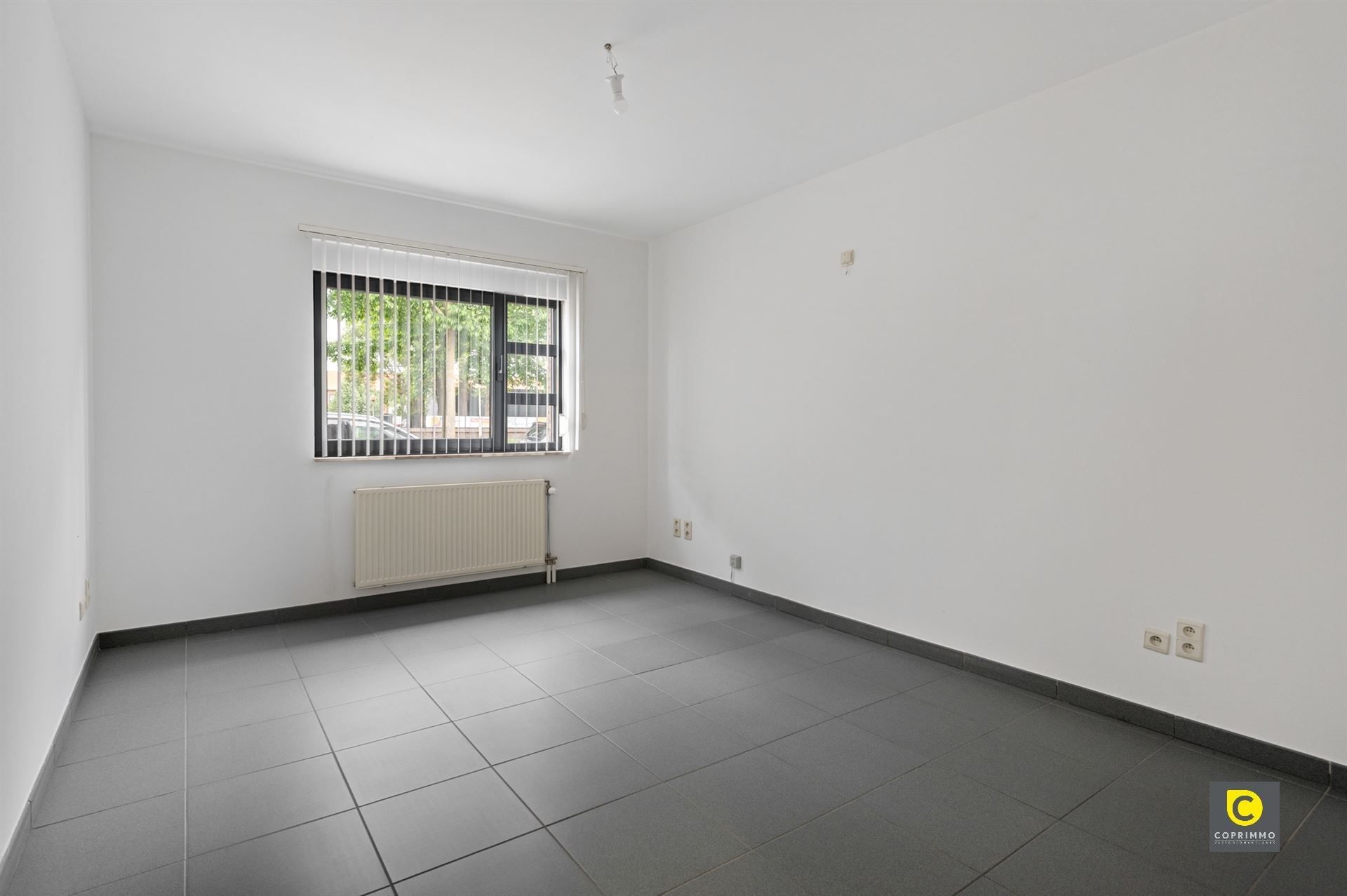 Gelijkvloers app met 2 slpk, tuin en garagebox foto 14