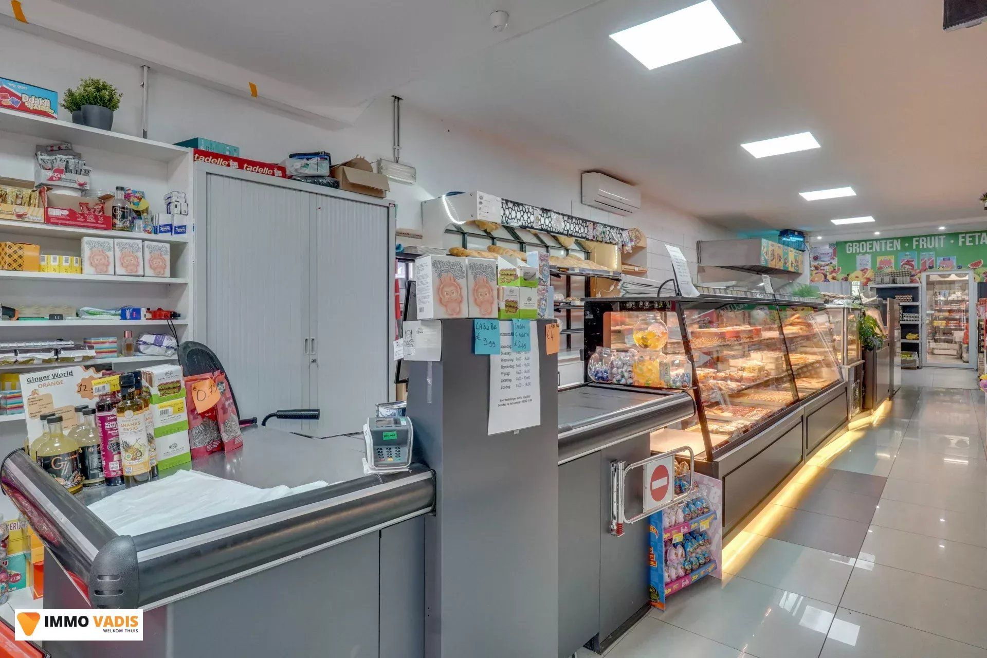 Handelspand met woonst en naastliggende woning foto 2