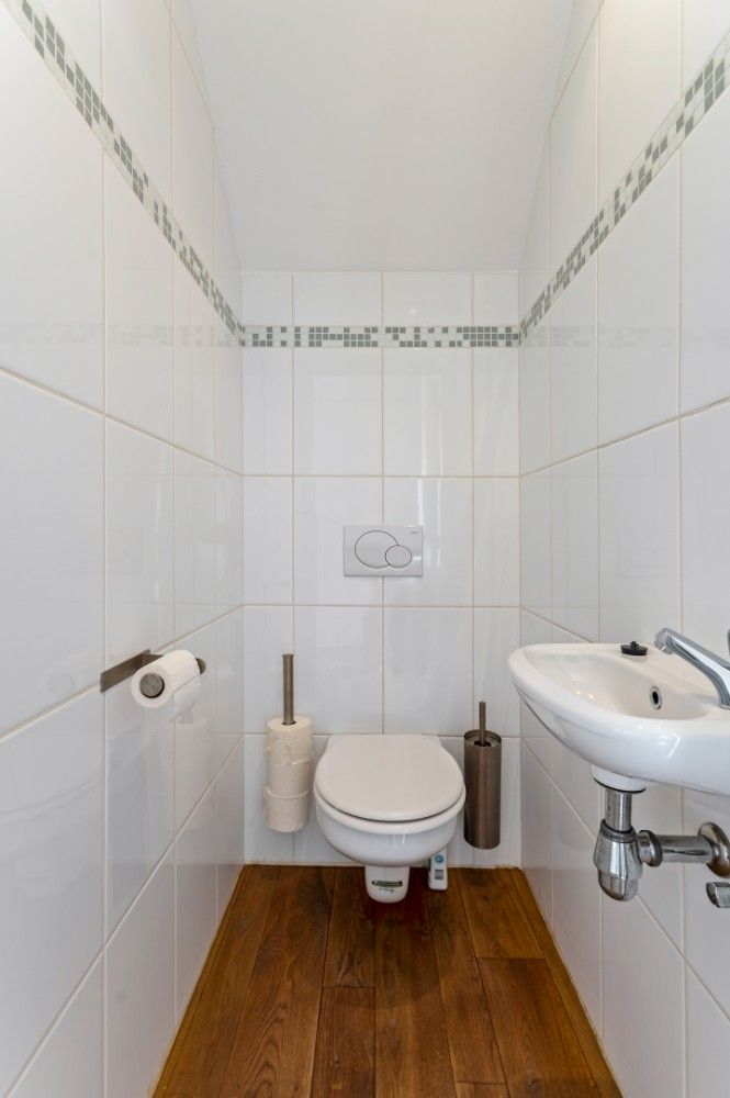 Ruime, instapklare woning met 3 slpk., dubbele garage en tuin foto 12
