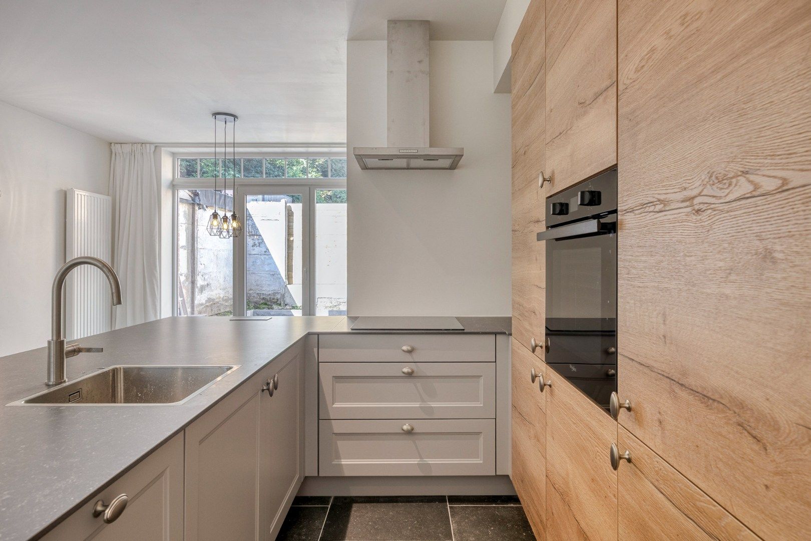 Totaal gerenoveerde woning met 4 slaapkamers en terras in het centrum van Leuven! – EPC 40 kWh/m² - bewoonbare oppervlakte 180 m²  foto 6