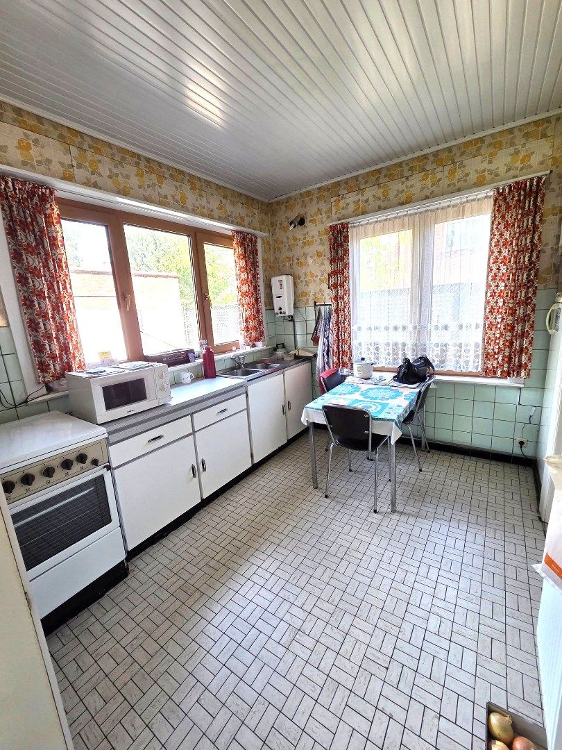 Te renoveren 4-gevelwoning in Peutie – Potentieel en perfecte ligging! foto 7