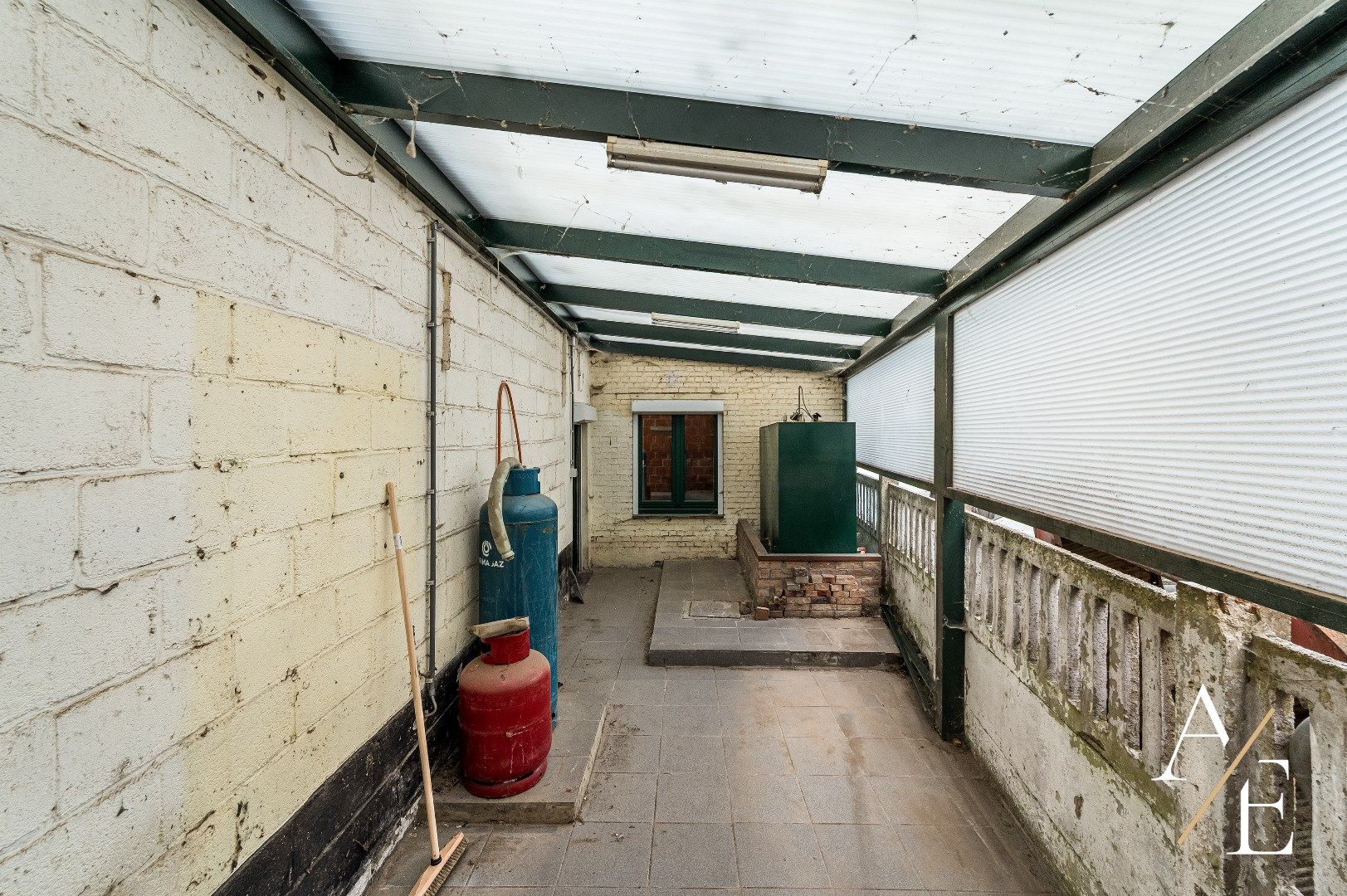 BERLARE - Te renoveren woning met tuin/parking/garage. foto 10