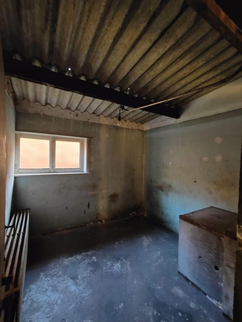 Woning met loods en voormalige showroom foto 6