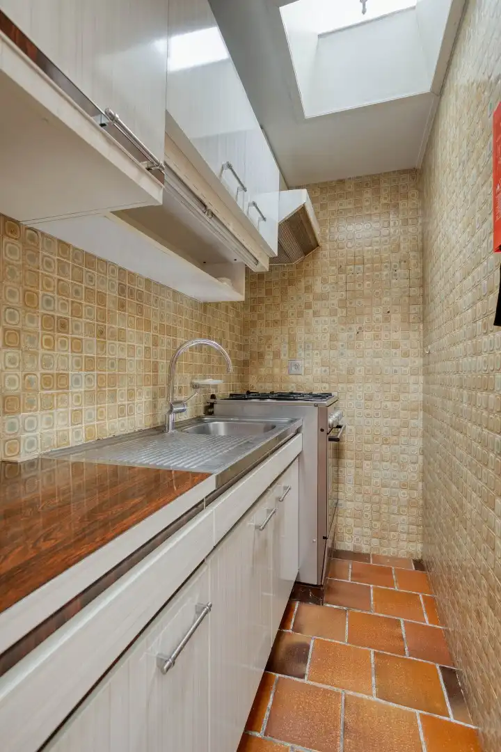 Te renoveren woning met tuin en garage in het centrum van Menen! foto 9