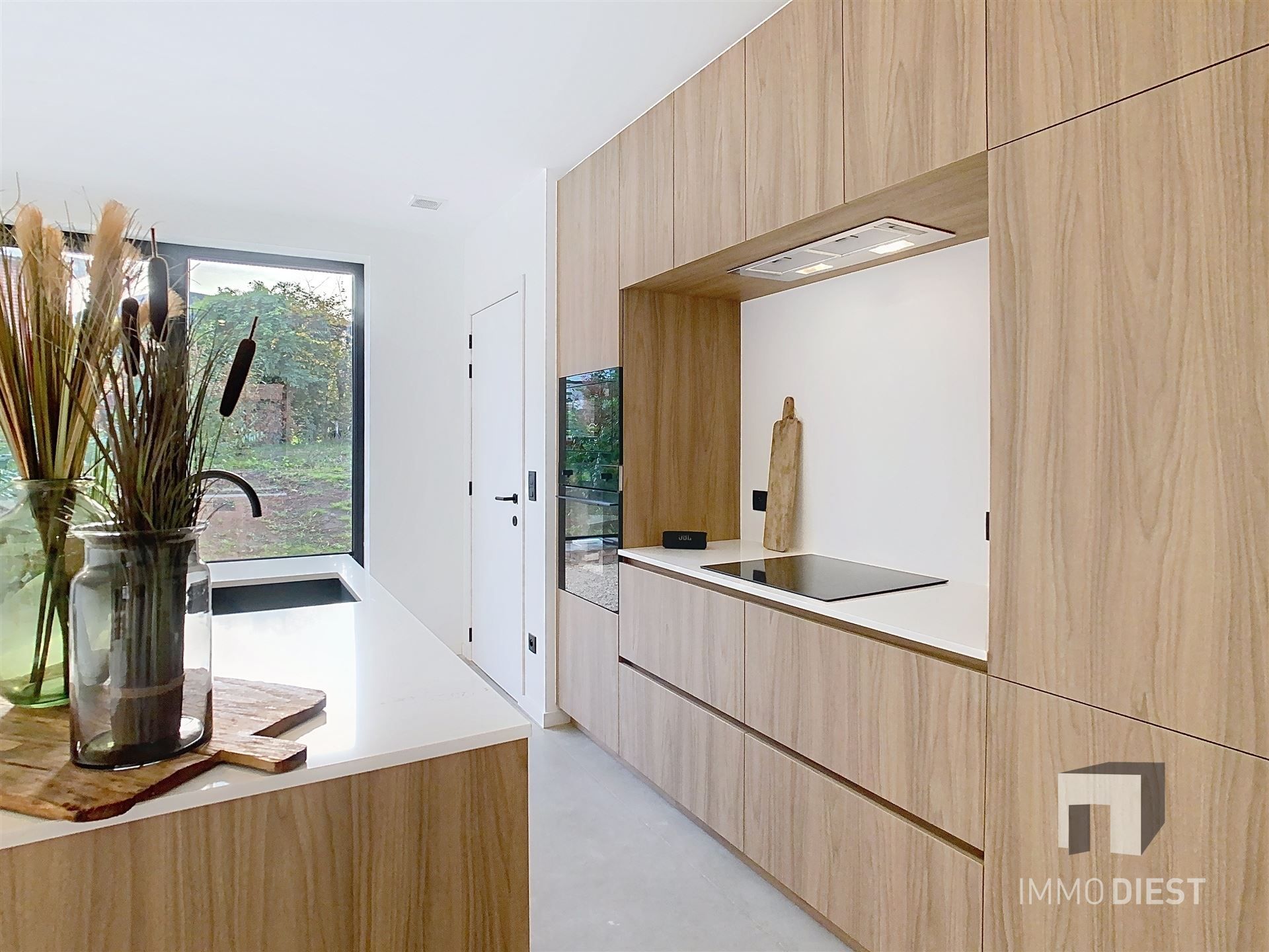 Charmante energiezuinige nieuwbouwwoning met zonnige tuin in hartje Zichem. foto 9