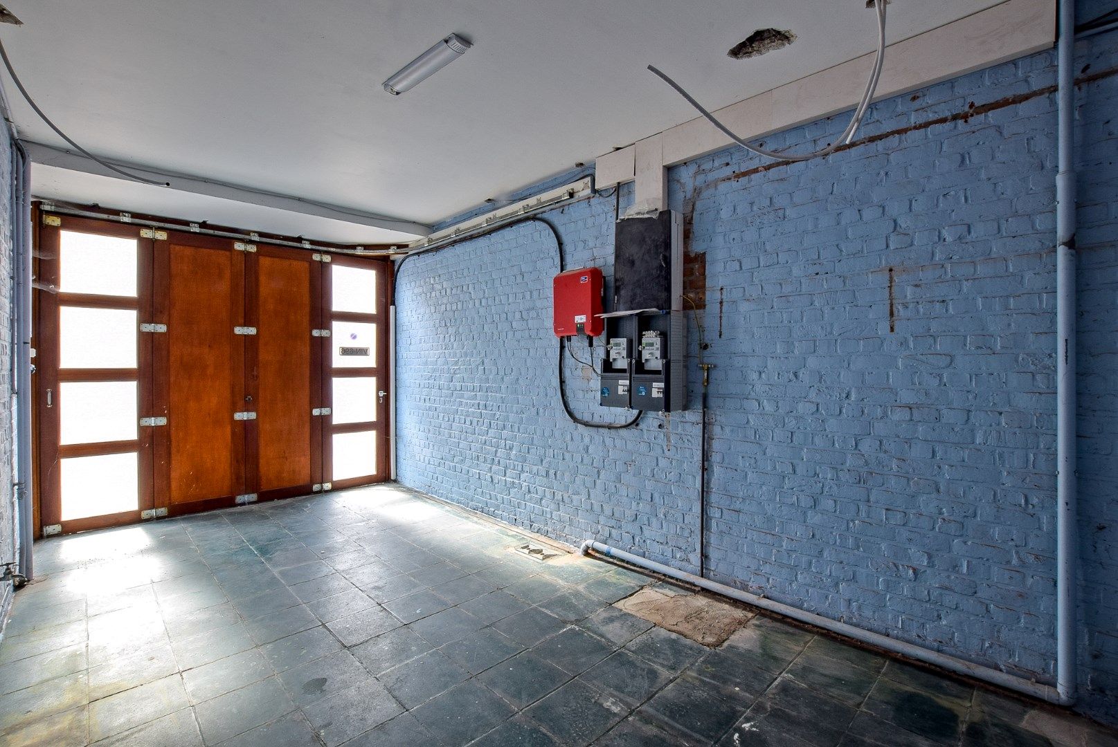 Ruime woning momenteel opgedeeld in 2 appartementen met inpandige garage en tuin op 240m². foto 11