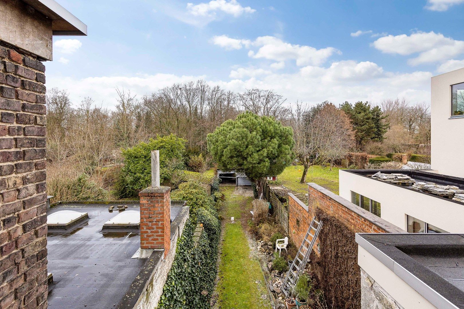 Te renoveren opbrengsteigendom met twee appartementen, parkings en tuin foto 17