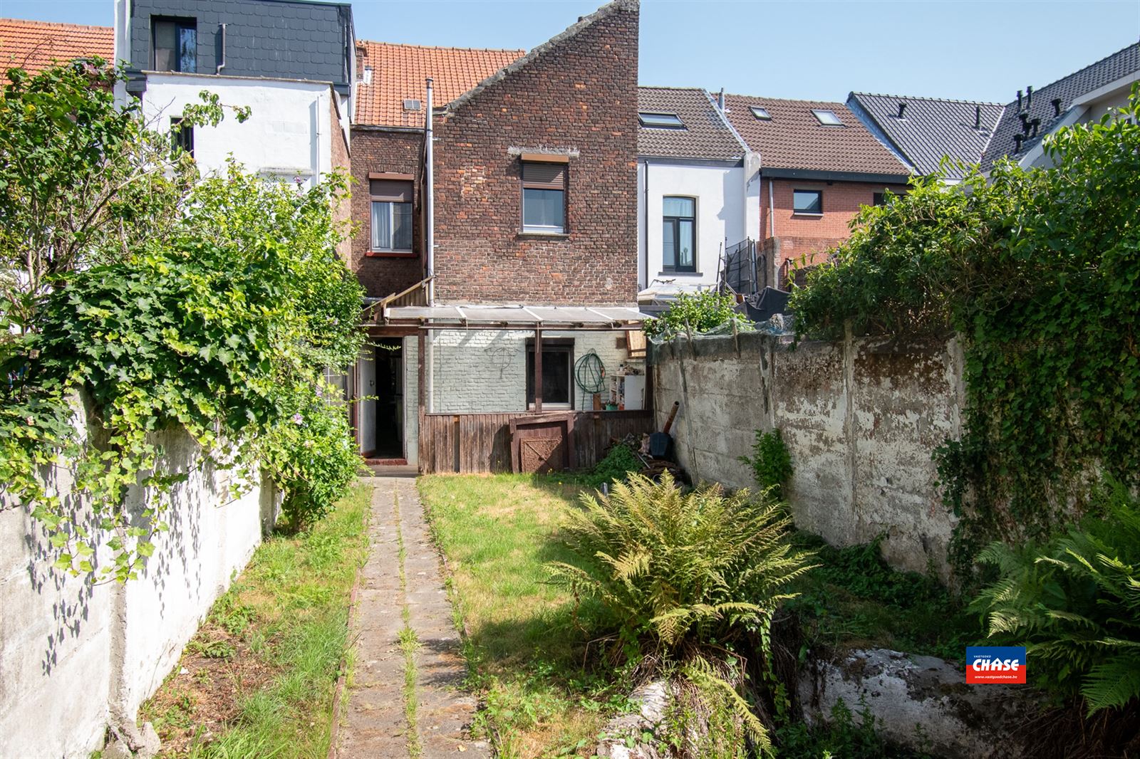 Rijwoning met 4/5 slaapkamers en tuin foto 9