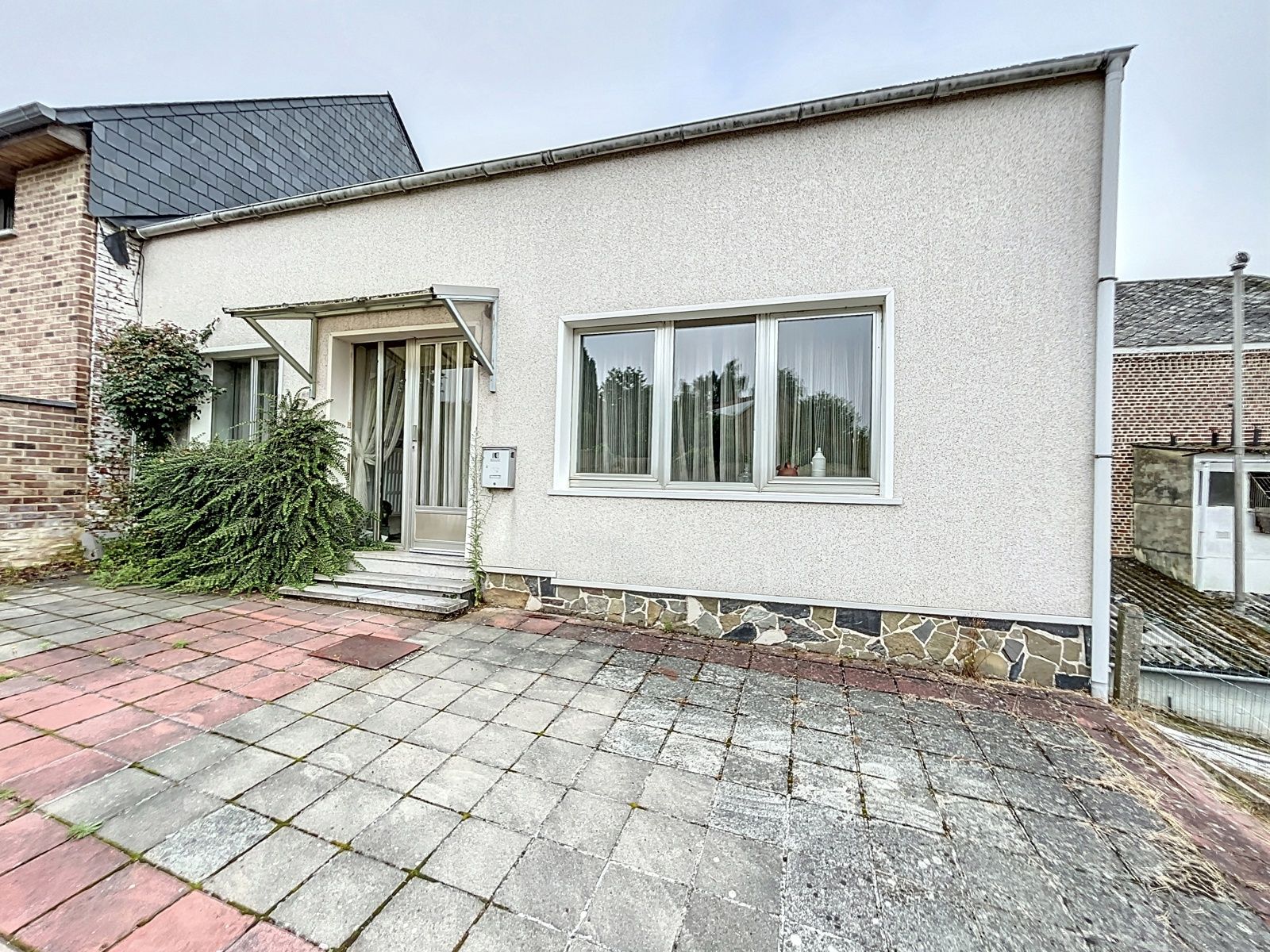 Gelijkvloerse woning met tuin  foto 1